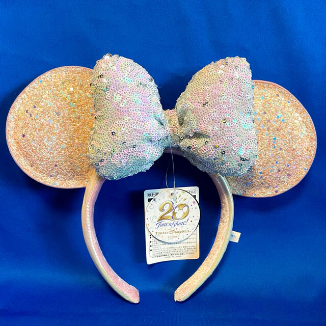 Disney(ディズニー)のディズニー 20周年 スパンコールカチューシャ　ピンク　タイムトゥシャイン　新品 エンタメ/ホビーのおもちゃ/ぬいぐるみ(キャラクターグッズ)の商品写真