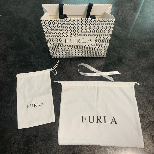 Furla(フルラ)のFURLA 紙袋　巾着　リボン レディースのバッグ(ショップ袋)の商品写真