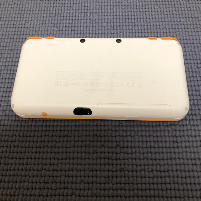 ニンテンドー2DS(ニンテンドー2DS)のNewニンテンドー2DS LL ホワイト×オレンジ（ジャンク） エンタメ/ホビーのゲームソフト/ゲーム機本体(携帯用ゲーム機本体)の商品写真