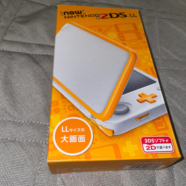 ニンテンドー3DS(ニンテンドー3DS)の新品未使用　ニンテンドー2DSLL Nintendo ホワイト＆オレンジ エンタメ/ホビーのゲームソフト/ゲーム機本体(携帯用ゲーム機本体)の商品写真