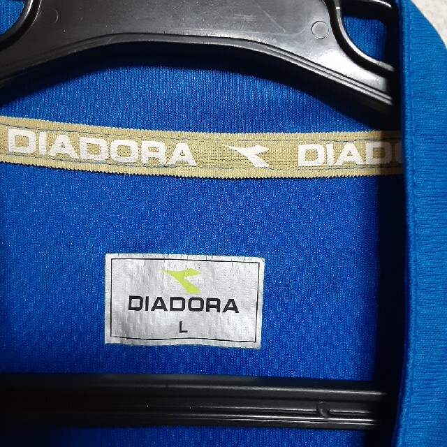 DIADORA(ディアドラ)のDIADORAジップアップ半袖Tシャツ スポーツ/アウトドアのサッカー/フットサル(ウェア)の商品写真