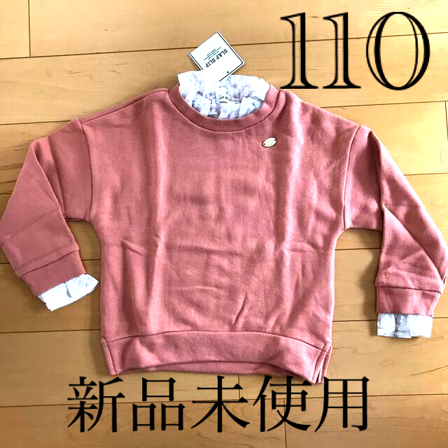 BeBe(ベベ)のSLAP SLIP 首袖レースオレンジトレーナー110 キッズ/ベビー/マタニティのキッズ服女の子用(90cm~)(Tシャツ/カットソー)の商品写真