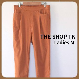 ザショップティーケー(THE SHOP TK)のTHE SHOP TK テーパードパンツ　カジュアルパンツ　着痩せ　オレンジ　M(カジュアルパンツ)