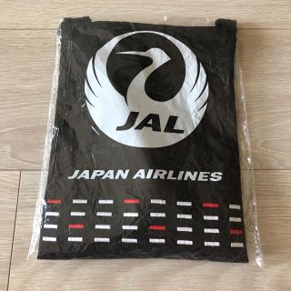 ジャル(ニホンコウクウ)(JAL(日本航空))の【新品】JALビジネスクラス アメニティ巾着ポーチ(旅行用品)