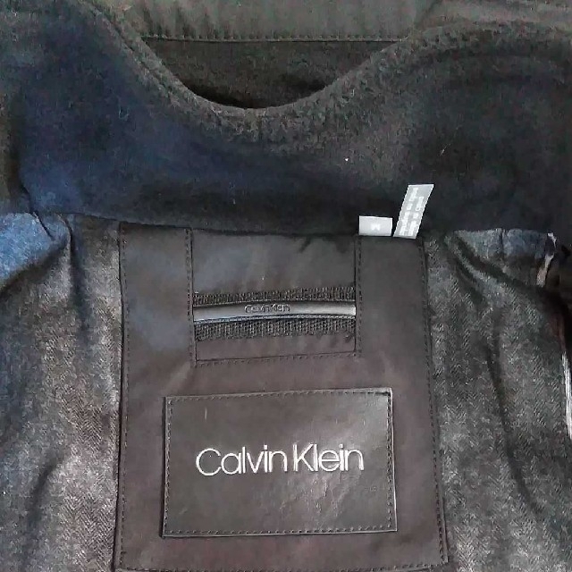 Calvin Klein(カルバンクライン)のCalvin Klein フーデットステンカラーコート ナイロン 撥水 ブラック メンズのジャケット/アウター(ステンカラーコート)の商品写真