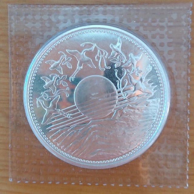 天皇陛下御在位60年記念１万円銀貨