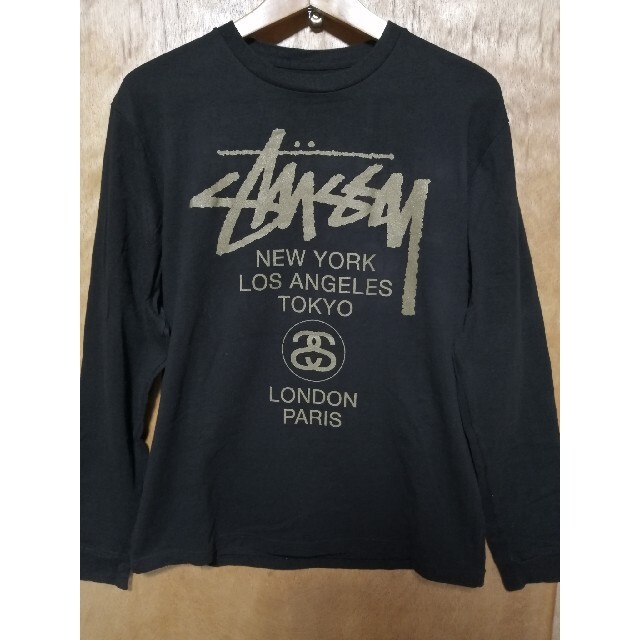 STUSSY(ステューシー)のSTUSSY ロンＴ ブラック ゴールド Lサイズ メンズのトップス(Tシャツ/カットソー(七分/長袖))の商品写真