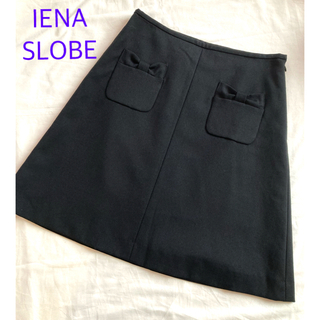スローブイエナ(SLOBE IENA)のSLOBE IENAスローブイエナ　台形スカート  ウール　リボン　ブラック(ひざ丈スカート)