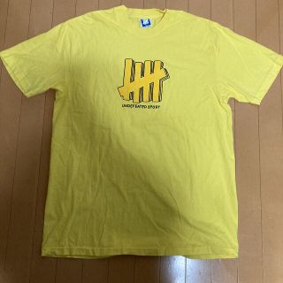 アンディフィーテッド(UNDEFEATED)のUNDEFEATED Tシャツ　イエロー　Lサイズ(Tシャツ/カットソー(半袖/袖なし))