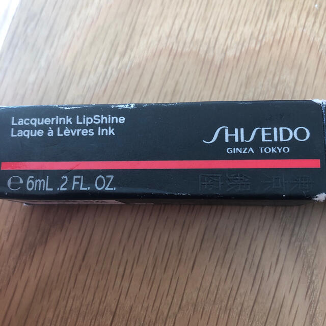 SHISEIDO (資生堂)(シセイドウ)の新品　Shiseido 資生堂　303 Lacquerink lipshine コスメ/美容のベースメイク/化粧品(リップグロス)の商品写真