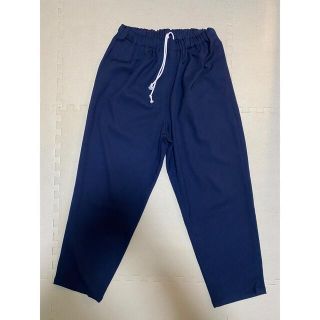 コモリ(COMOLI)のYUAN RELAX TUCK SLACKS navy wed store(スラックス)