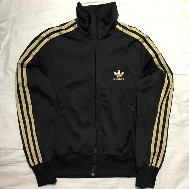 adidas(アディダス)のアディダス　オリジナルス　ジャージ  黒×金 レディースのジャケット/アウター(その他)の商品写真