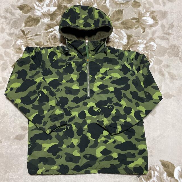 A BATHING APE(アベイシングエイプ)のAPE BAPE KAWS CAMO 迷彩　ジャケット　パーカー　ハーフジップ メンズのジャケット/アウター(ナイロンジャケット)の商品写真