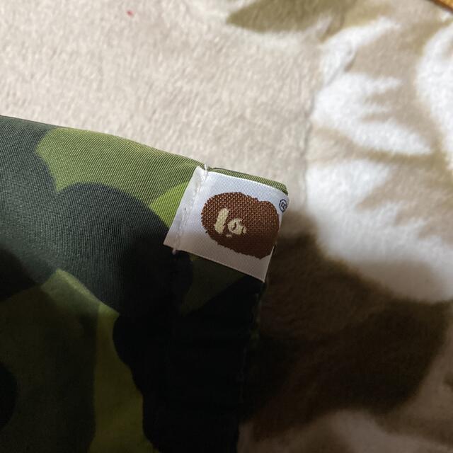 A BATHING APE(アベイシングエイプ)のAPE BAPE KAWS CAMO 迷彩　ジャケット　パーカー　ハーフジップ メンズのジャケット/アウター(ナイロンジャケット)の商品写真