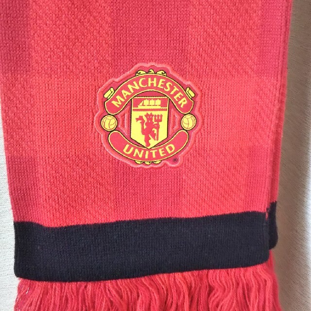 NIKE(ナイキ)の専用です！MANCHESTER UNITED マフラー スポーツ/アウトドアのサッカー/フットサル(応援グッズ)の商品写真