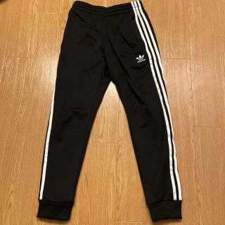 アディダス(adidas)のadidas アディカラークラシック Primeblue SST トラックパンツ(ジャージ)