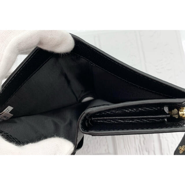 コーチリペ COACH ブラック アウトレット品の通販 by キキララ's shop|コーチならラクマ - COACH 二つ折り財布 クロスグレインレザー されている