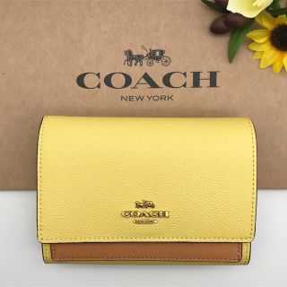 コーチ(COACH)のCOACH ミディアム フラップ ウォレット カラーブロック イエロー 新品(財布)