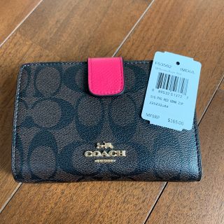 コーチ(COACH)のコーチ　二つ折り財布　ショッキングピンク　ブラウンシグネチャー(財布)