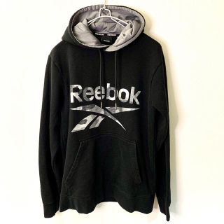 リーボック(Reebok)のReebok リーボック カモフラロゴ長袖スウェットパーカー ブラック S(パーカー)