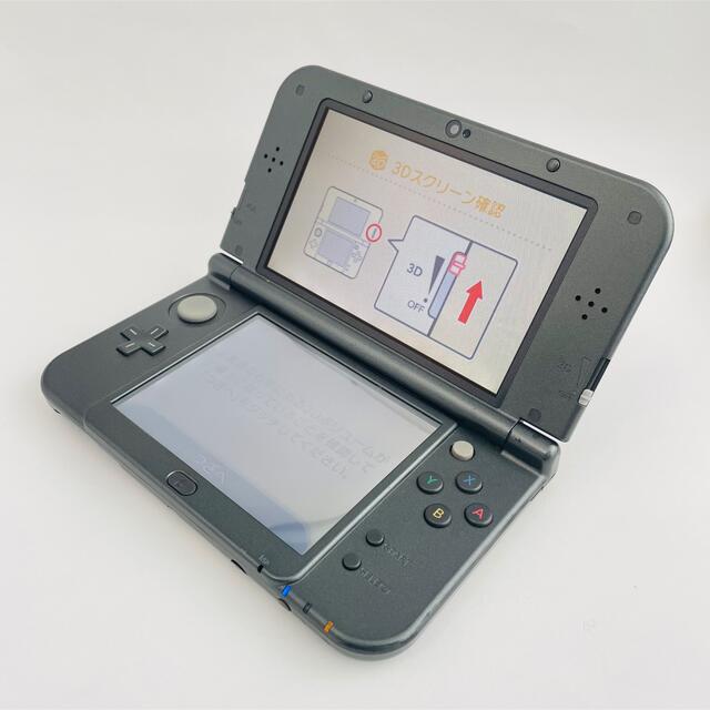 ニンテンドー3DS(ニンテンドー3DS)のNewニンテンドー3DS LL メタリックブラック 充電器付き エンタメ/ホビーのゲームソフト/ゲーム機本体(携帯用ゲーム機本体)の商品写真