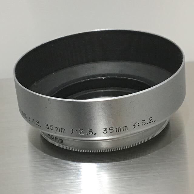 Canon(キヤノン)のOLD CANON Φ40mm Lマウント レンズ クラシックフード シルバー スマホ/家電/カメラのカメラ(レンズ(単焦点))の商品写真