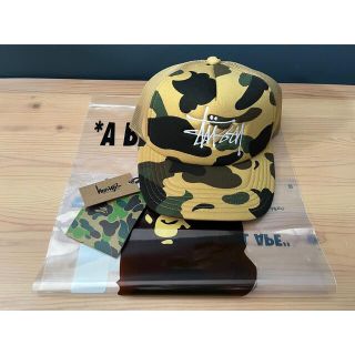 アベイシングエイプ(A BATHING APE)の5%クーポン配布新品未使用 🦍BAPE X STÜSSY TRUCKER CAP(キャップ)