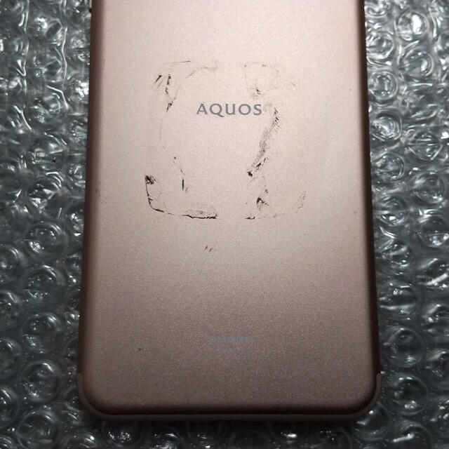 AQUOS(アクオス)の[ジャンク] SHARP SH-M12 64GB SIMフリー デモ機 ピンク スマホ/家電/カメラのスマートフォン/携帯電話(スマートフォン本体)の商品写真