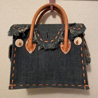 グレースコンチネンタル(GRACE CONTINENTAL)のCarving tribes デニムバッグ(ハンドバッグ)