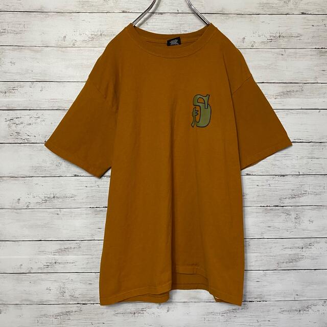 STUSSY Sロゴ バックプリント マスタードイエロー Tシャツ-siegfried