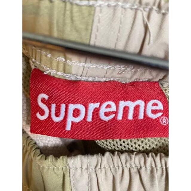 Supreme(シュプリーム)のSupreme Warm Up Pant カモ M ナイロンパンツ pants メンズのパンツ(ワークパンツ/カーゴパンツ)の商品写真