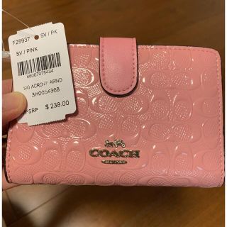 コーチ(COACH)のショプバ・箱付き　二つ折り　ピンクエナメル(財布)