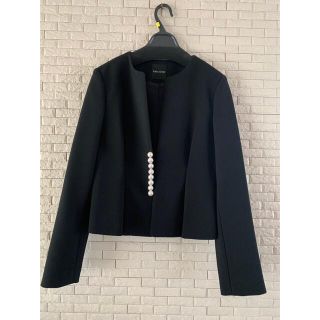 バーニーズニューヨーク(BARNEYS NEW YORK)のyokochan  パール ジャケット 黒(ノーカラージャケット)