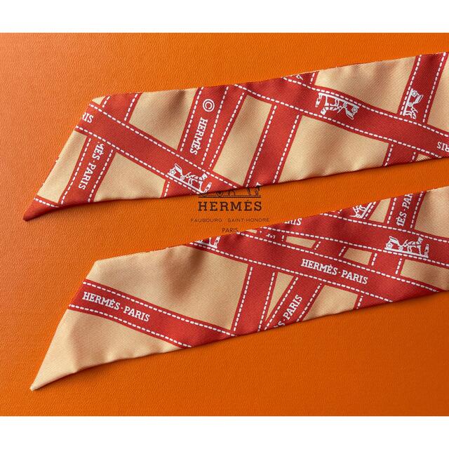 Hermes(エルメス)の未使用　美品　エルメス　リボン柄　ツイリー　スカーフ　箱付き　オレンジ レディースのファッション小物(バンダナ/スカーフ)の商品写真