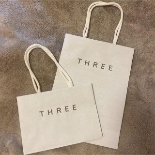 スリー(THREE)のthree ショップ袋【新品未使用】二つセット(ショップ袋)