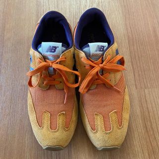 ニューバランス(New Balance)のニューバランス　25センチ　クロスカントリー　オレンジ色(スニーカー)