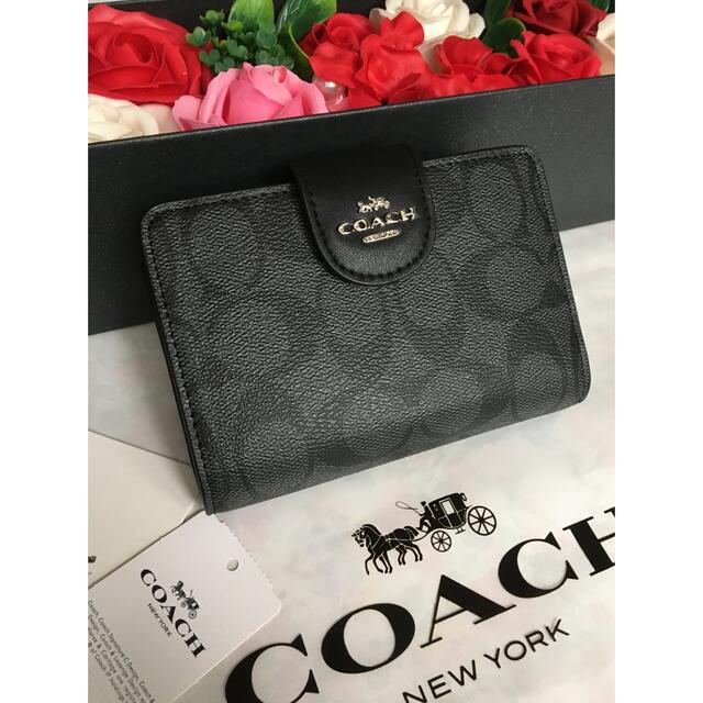 新品未使用袋付きcoachコーチニつ折り財布シグネチャー