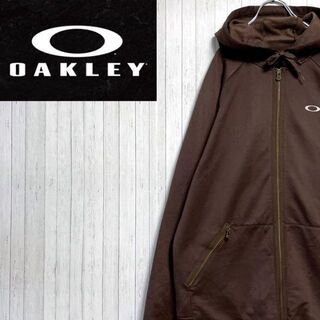 オークリー(Oakley)のオークリー　パーカー　スウェット ブラウン　ジップアップ　裏起毛　袖ポケ　L(パーカー)