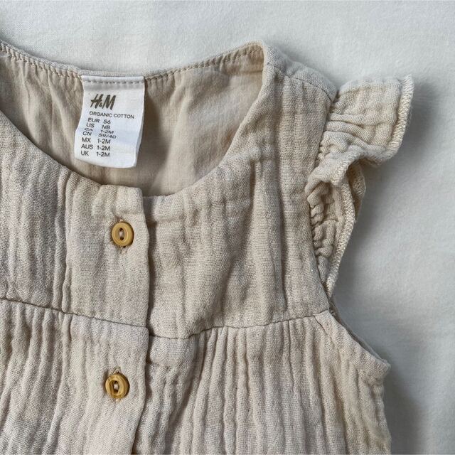 H&M(エイチアンドエム)のH&M BABY コットンロンパース キッズ/ベビー/マタニティのベビー服(~85cm)(ロンパース)の商品写真