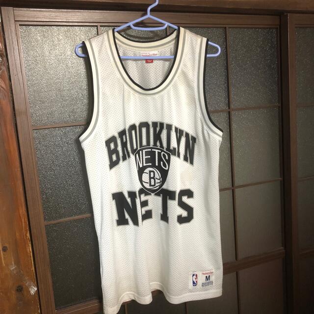 MITCHELL & NESS(ミッチェルアンドネス)の希少　mitchell & ness NBA NETS タンクトップ  kaws メンズのトップス(タンクトップ)の商品写真