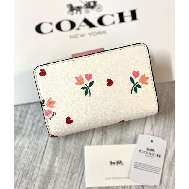 【新品】COACHコーチ 二つ折り財布 花柄 シグネチャー ベビーピンク