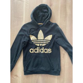 アディダス(adidas)のadidasオリジナルス ビックロゴパーカー ゴールド(パーカー)