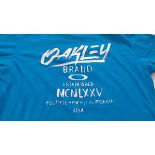 オークリー(Oakley)のオークリー　OAKLEY　Tシャツ　Ｌ　バックプリント　青(Tシャツ/カットソー(半袖/袖なし))