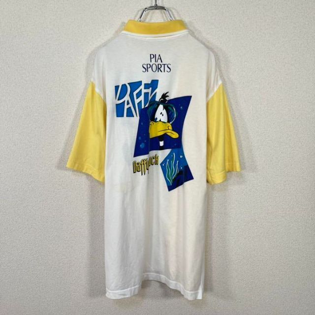 PIA SPORTS(ピアスポーツ)の【90s】PIASPORTS×ルーニーテューンズ　ポロシャツ　ダフィーダック　白 メンズのトップス(ポロシャツ)の商品写真