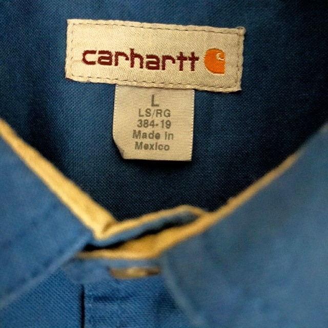 carhartt(カーハート)のカーハート　ワークシャツ　ネイビー　L　ワッペン　企業ロゴ メンズのトップス(シャツ)の商品写真