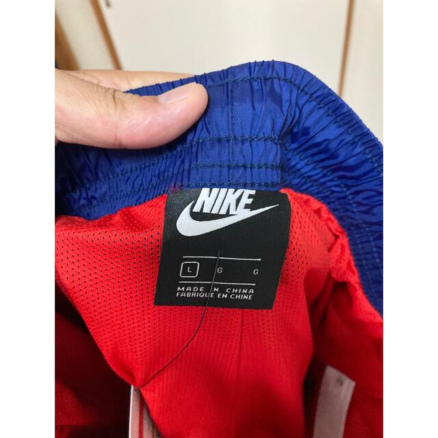 NIKE(ナイキ)の新品未使用！ナイキ！ナイロンパンツ！size L！ネイビー×レッド！ジョーダン メンズのジャケット/アウター(ナイロンジャケット)の商品写真