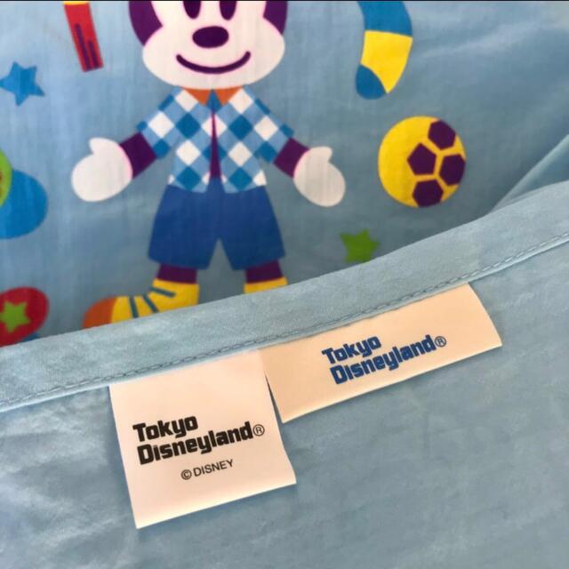 Disney(ディズニー)のミッキーマウス エプロン  水色 きんちゃく袋付き／フリーサイズ エンタメ/ホビーのおもちゃ/ぬいぐるみ(キャラクターグッズ)の商品写真