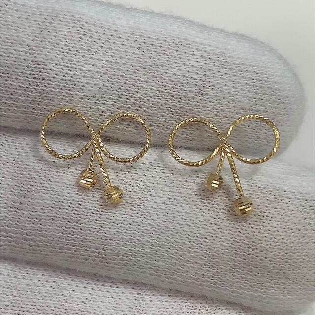 K18デザインピアス リボン - ピアス