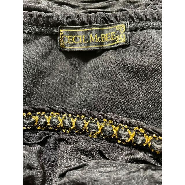 CECIL McBEE(セシルマクビー)のセシルマクビー　シャーリングスカート　ブラック×ゴールド　タイトスカート レディースのスカート(ミニスカート)の商品写真
