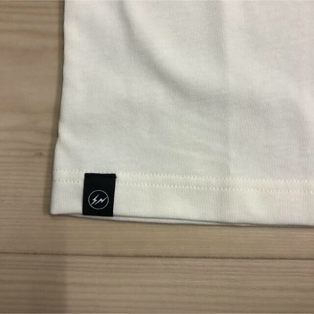 FRAGMENT(フラグメント)の新品タグ付き　travis scott fragment Tシャツ　xs メンズのトップス(Tシャツ/カットソー(半袖/袖なし))の商品写真